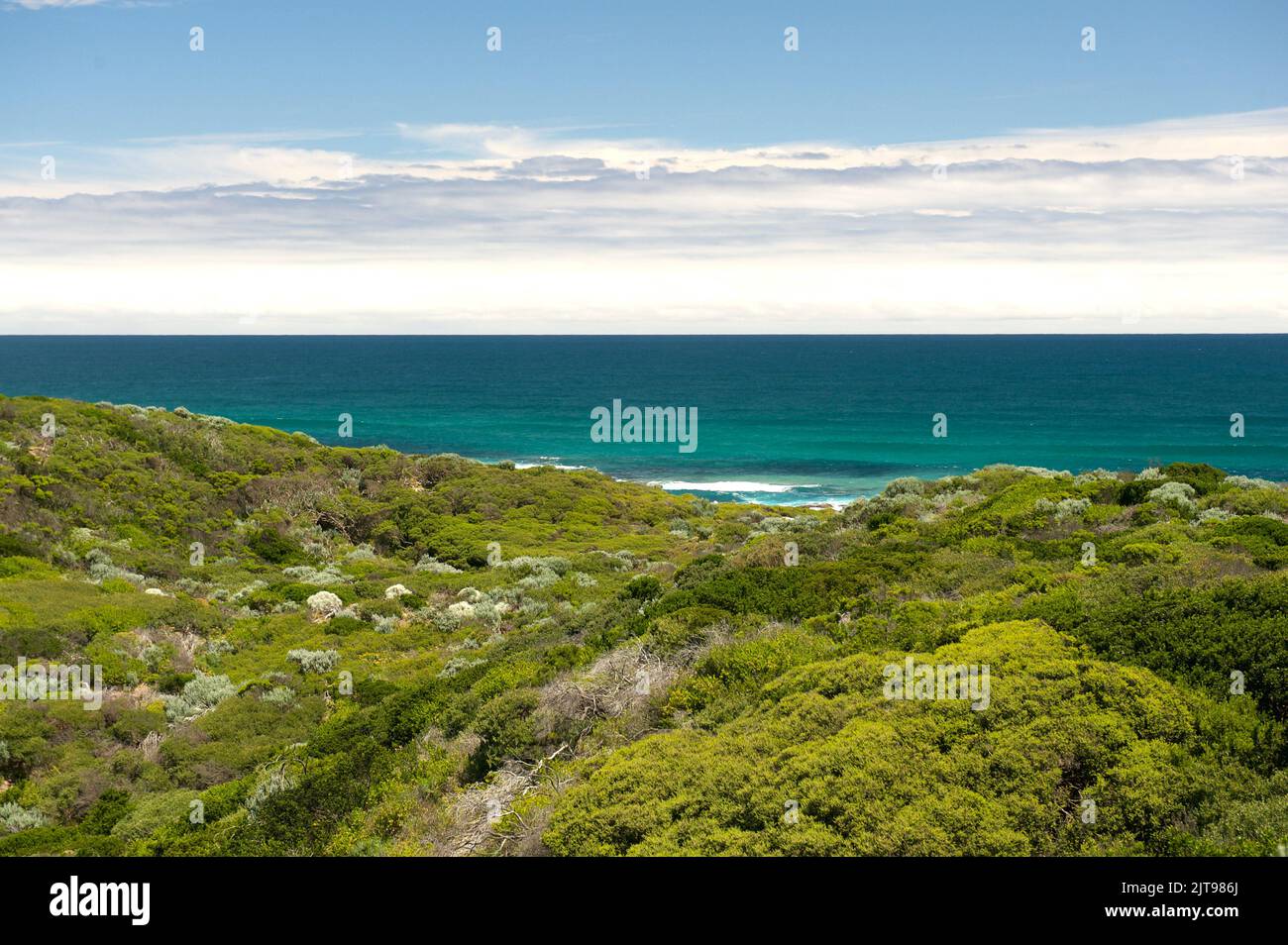 Point Nepean, Victoria, Australia, on a sunny day. The shallows had a lovely turquoise colour, which contrasted with the green of the coastal scrub. Stock Photo