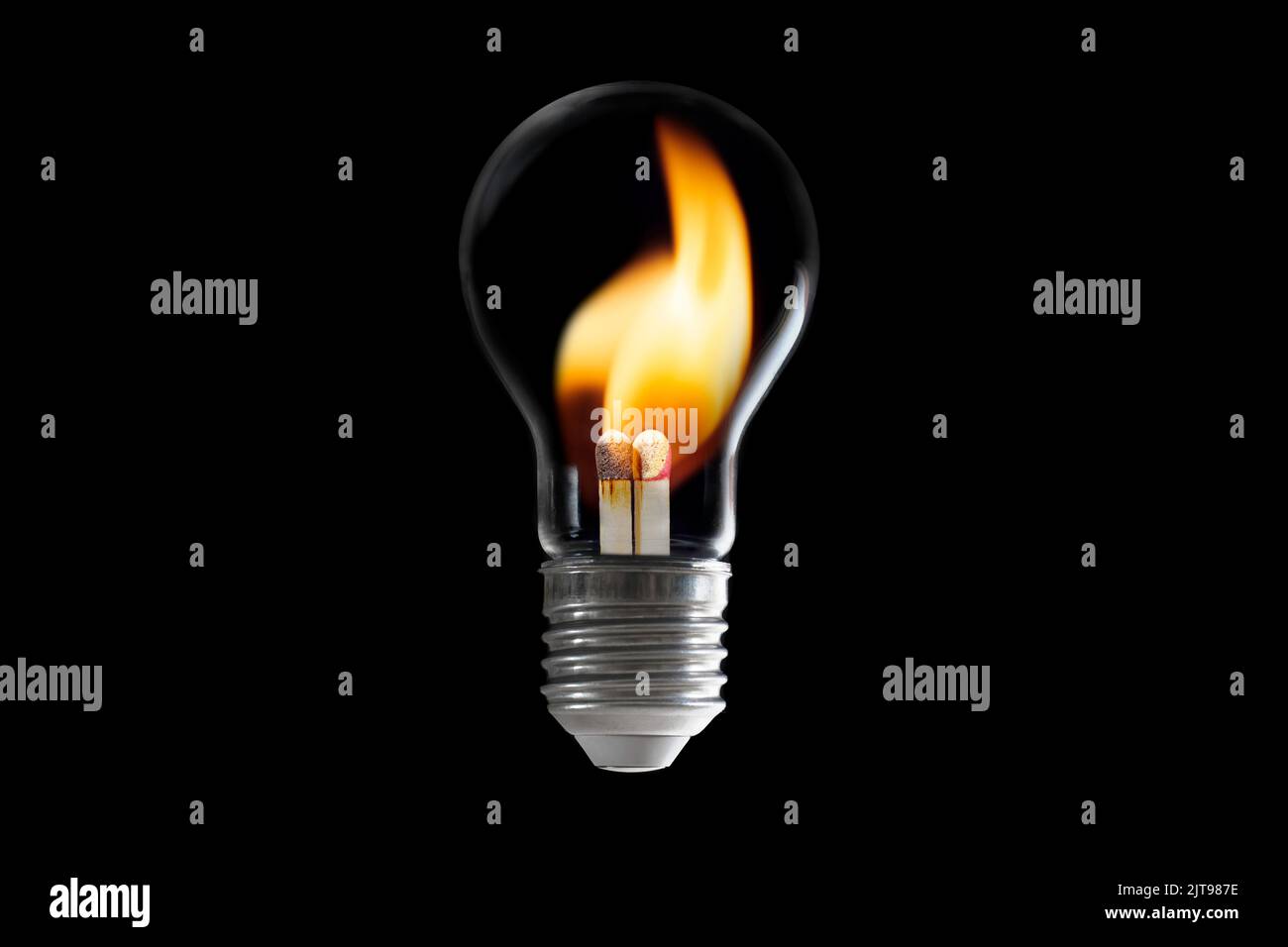 Incandescent light bulb with burning matches inside isolated on black