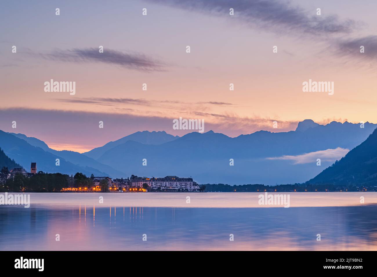 An early sunrise in summer at Zell am See, acity located at the Zeller See, a lake in central Austria with access to Kaprun and the Großglockner High Stock Photo