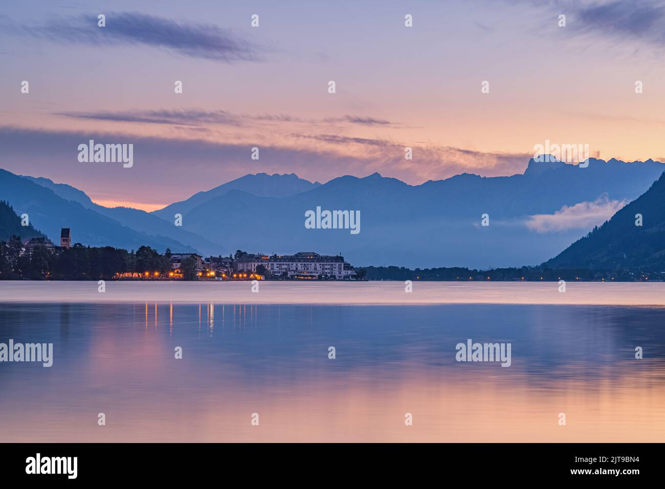 An early sunrise in summer at Zell am See, acity located at the Zeller See, a lake in central Austria with access to Kaprun and the Großglockner High Stock Photo
