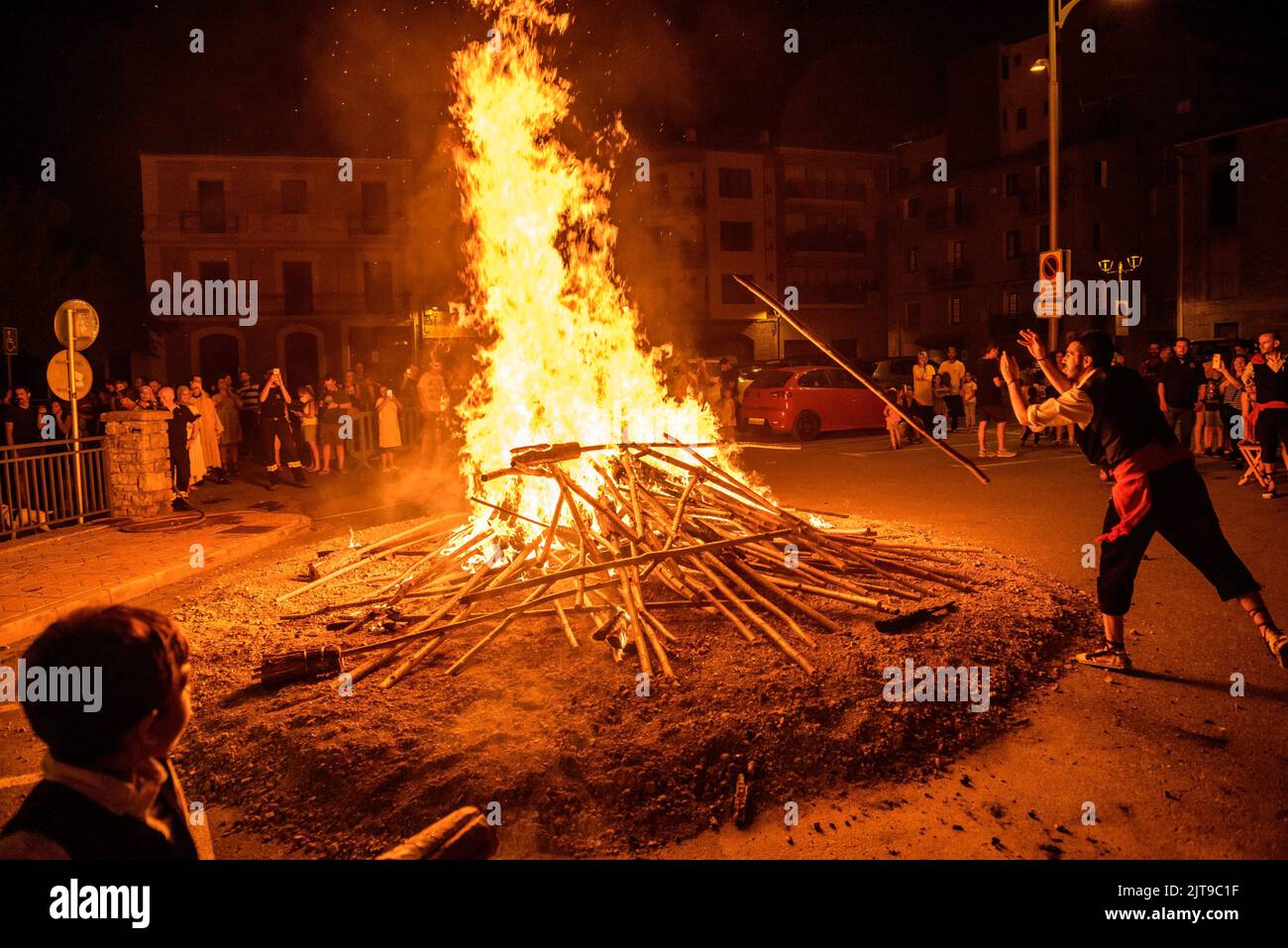 Bonfire in the torchlight descent of La Pobla de Segur, an UNESCO intangible heritage in the Pyrenees (Pallars Jussà, Lleida, Catalonia, Spain) Stock Photo