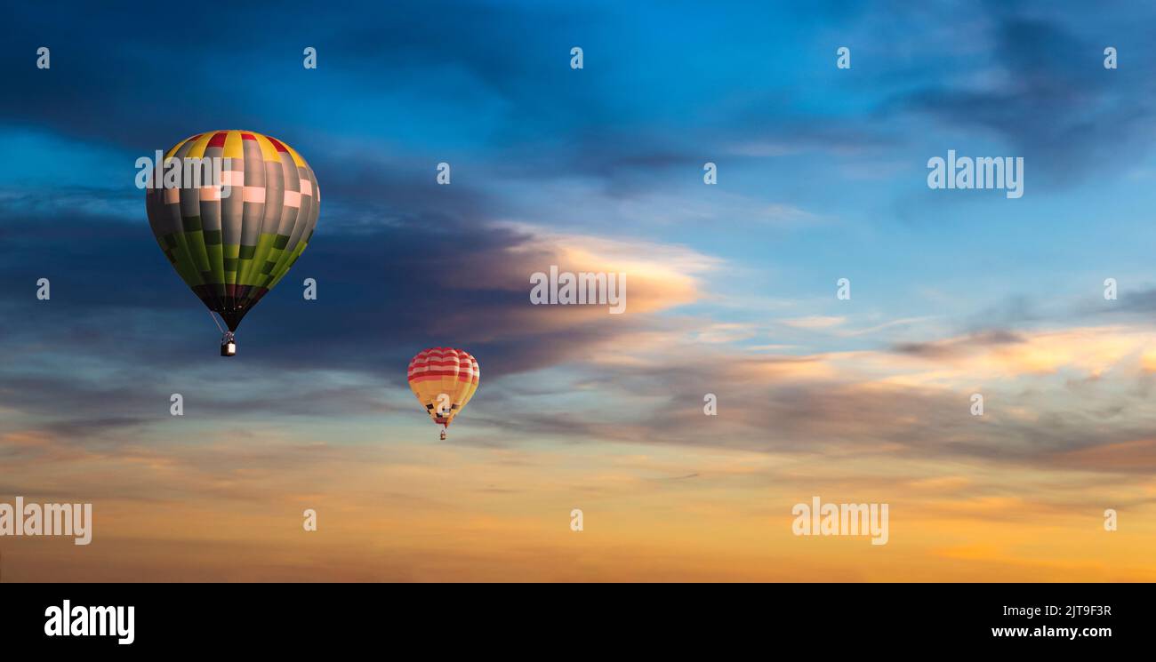Colorful hot air balloons flying on the sunset sky background Stock ...
