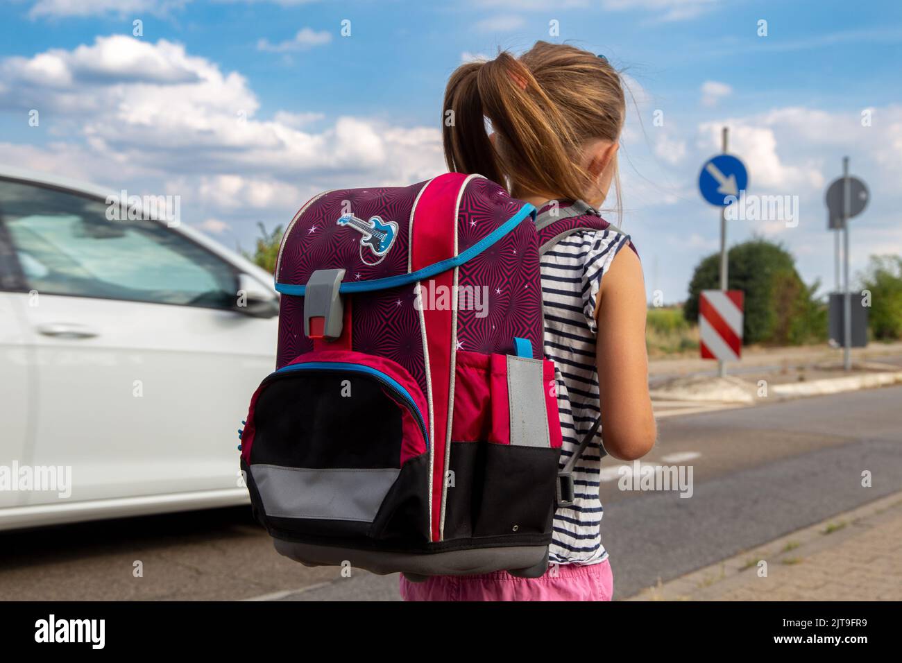 Symbol image: Schoolchild on the way to school (Model released) Stock Photo