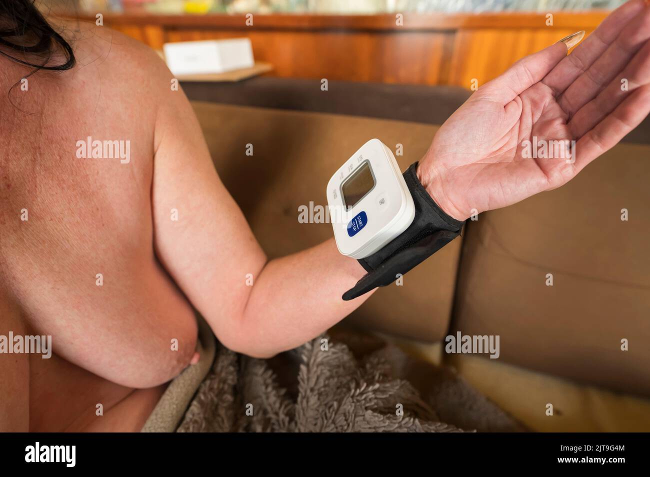 A woman with taking blood pressure Stock Photo