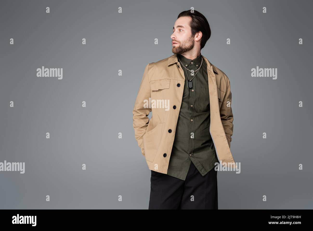 Man in black shirt and beige jacket hi-res stock photography and images -  Alamy
