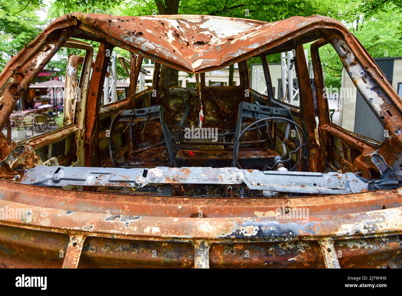 Vehicle in which three Ukrainian women and a 14-year-girl were killed in Bucha, Ukraine, on display in Berlin for the 'Testament of Bucha' project Stock Photo