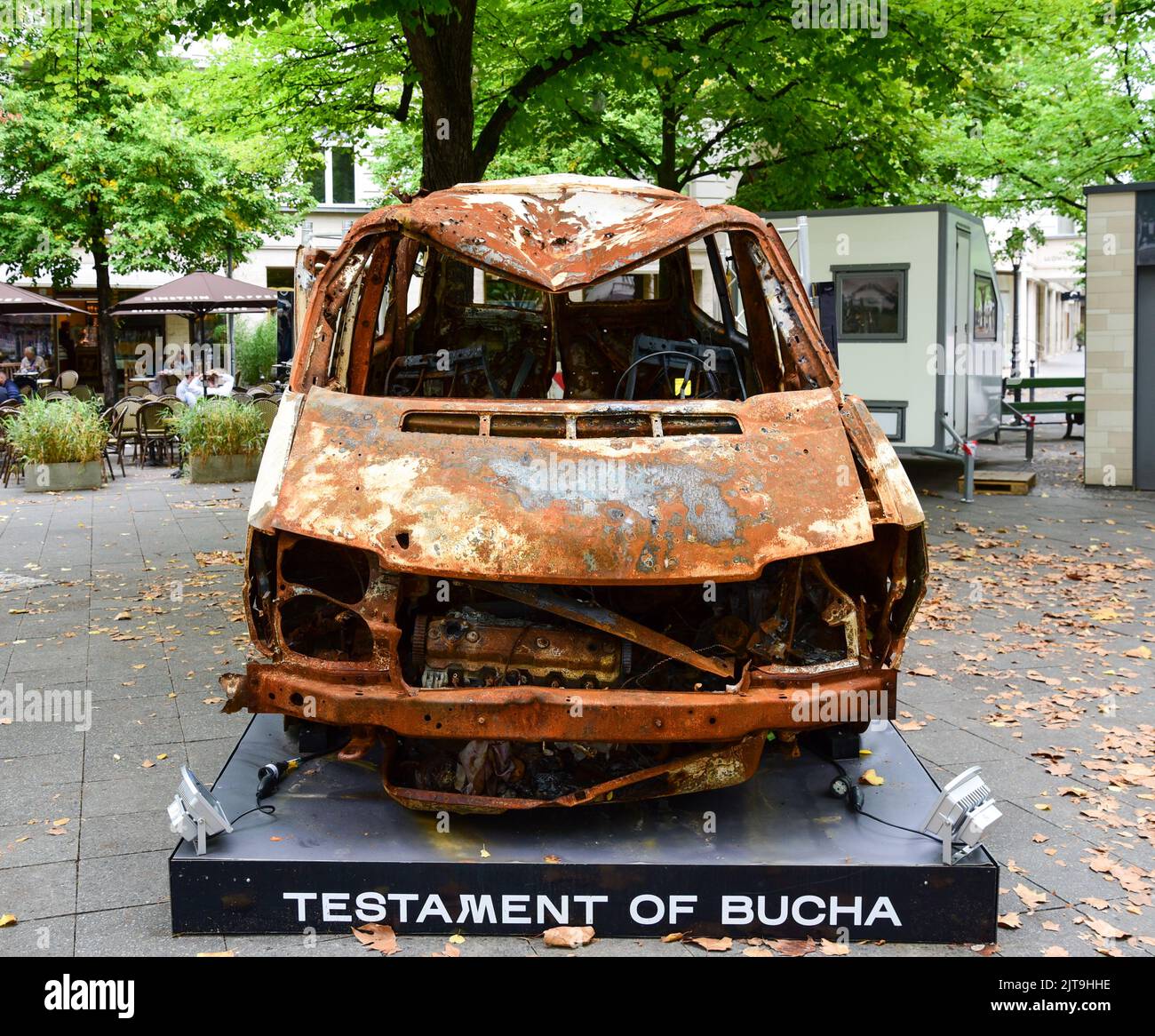 Vehicle in which three Ukrainian women and a 14-year-girl were killed in Bucha, Ukraine, on display in Berlin for the 'Testament of Bucha' project Stock Photo