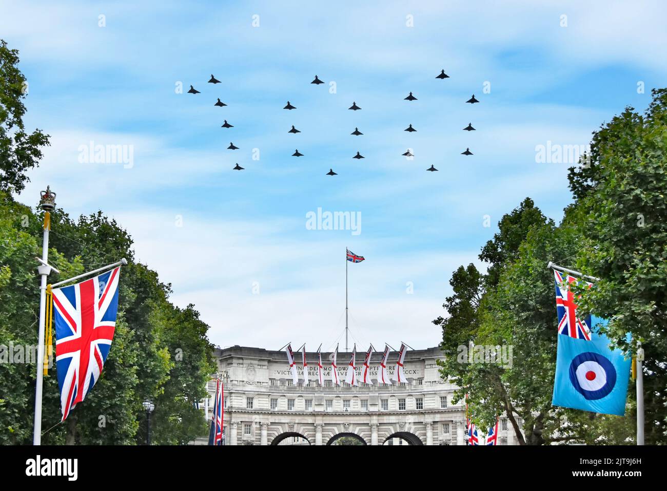 22 Eurofighter Typhoon FGR4 fighter plane RAF ensign centenary flypast over The Mall London flying in 100 figure formation Union Jack flag England UK Stock Photo