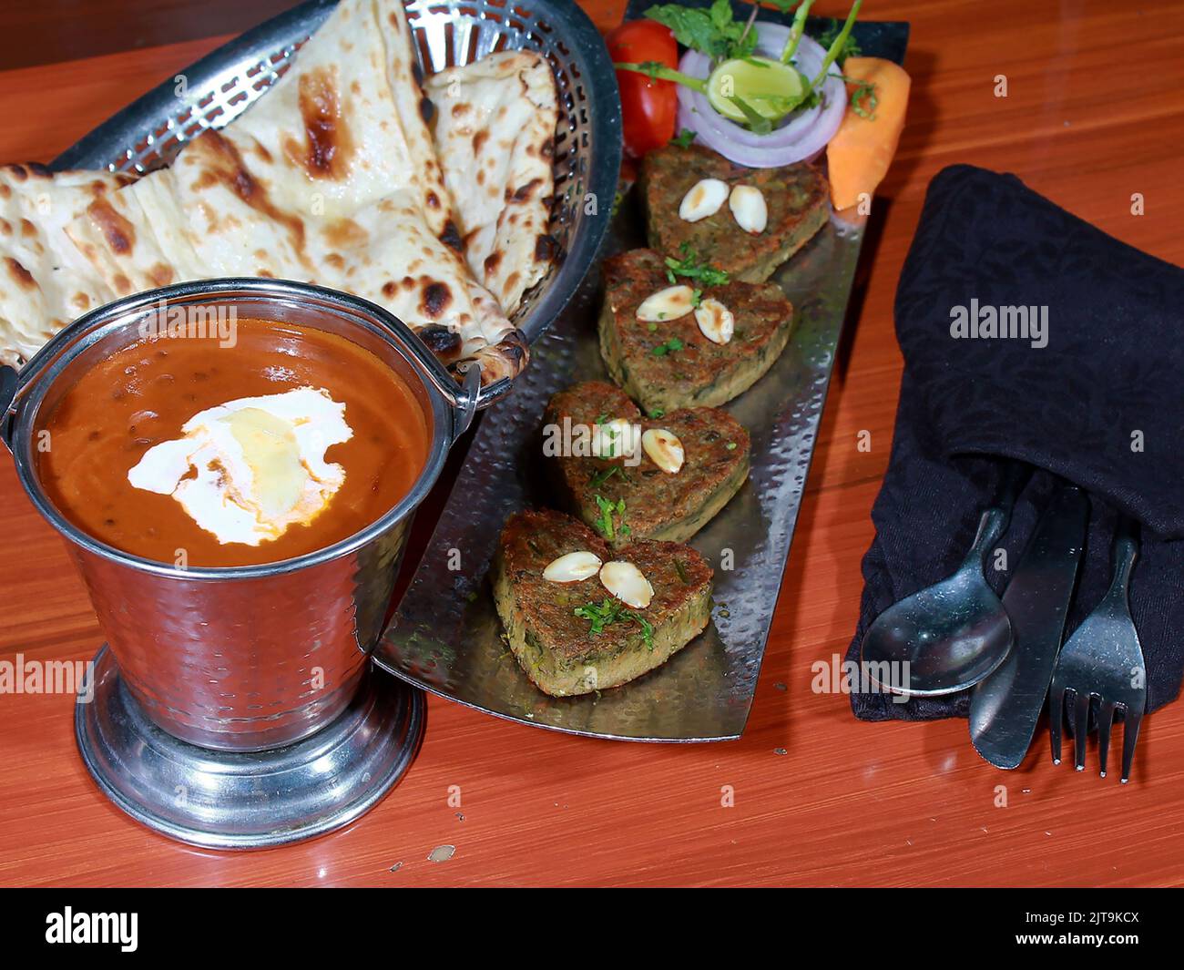 A closeup of Naram dil kabab served with maa ki daal and butter naan Stock Photo Alamy