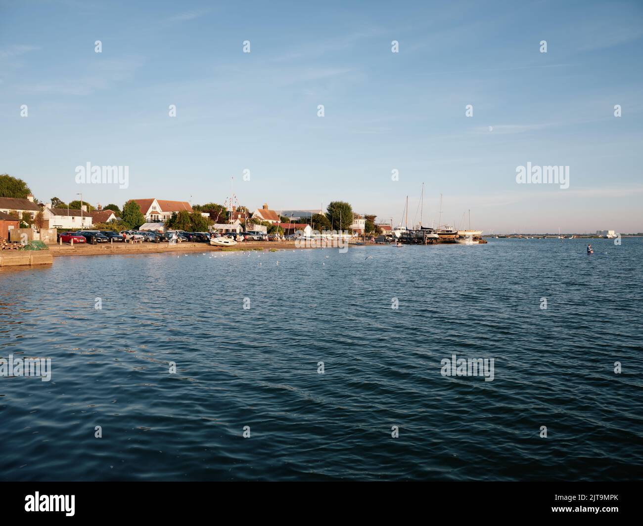 The harbour seafront summer landscape of West Mersea Harbour, Mersea Island, Essex England UK