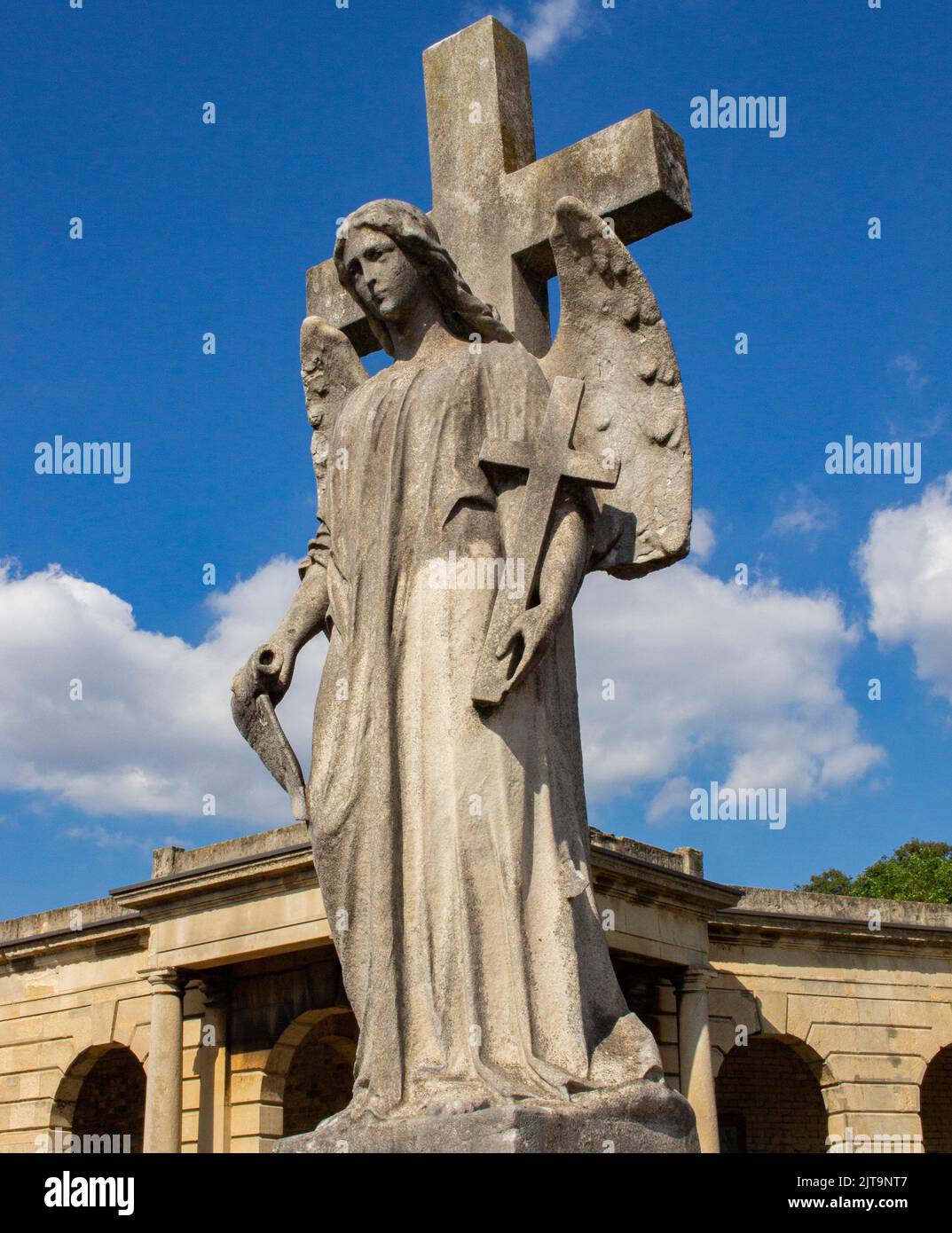 Brompton Cemetery, Kensington London, UK; a tomb featuring an angel and ...