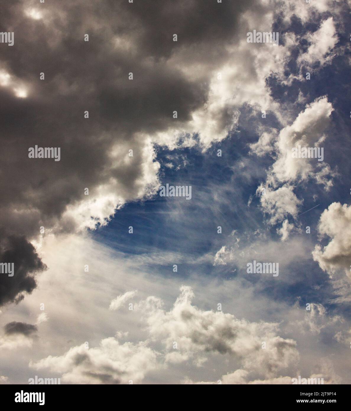 Dramatic storm clouds against a blue sky Stock Photo