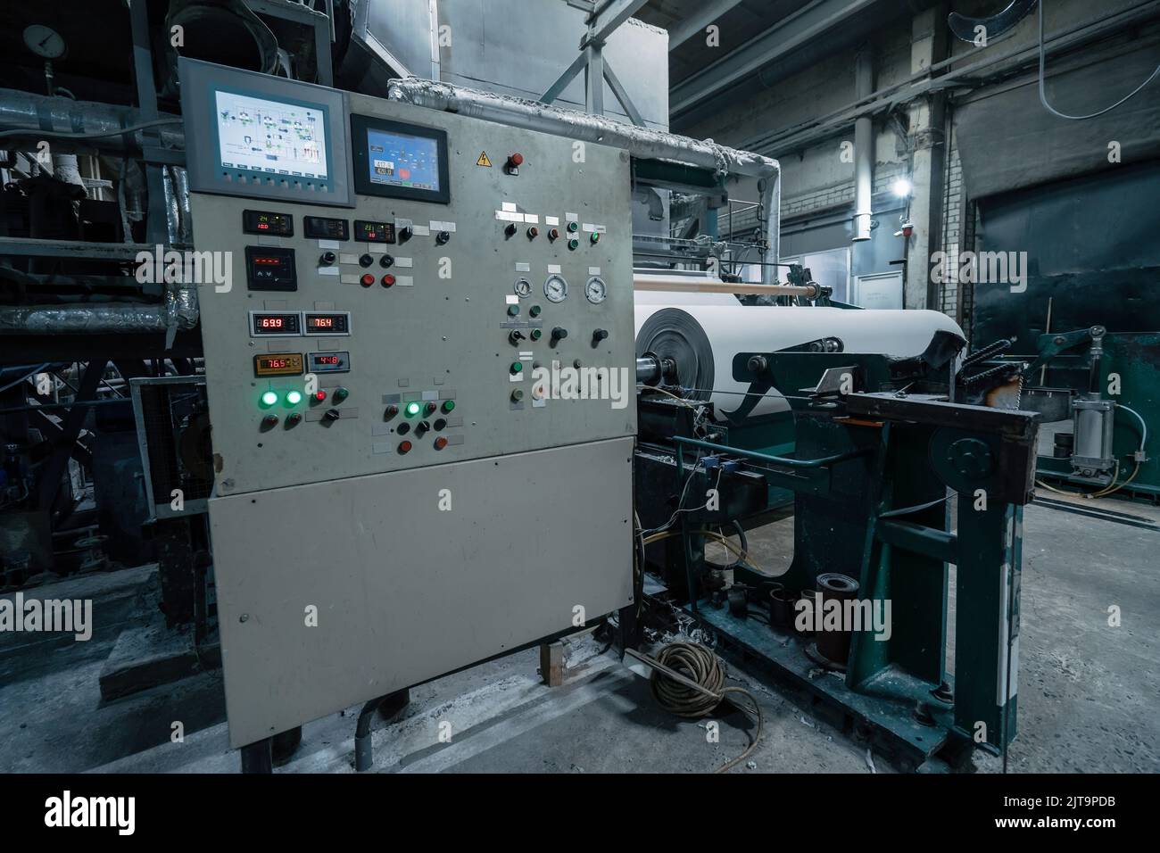 Paper production machine in wastepaper recycling factory. Paper and pulp mill. Stock Photo