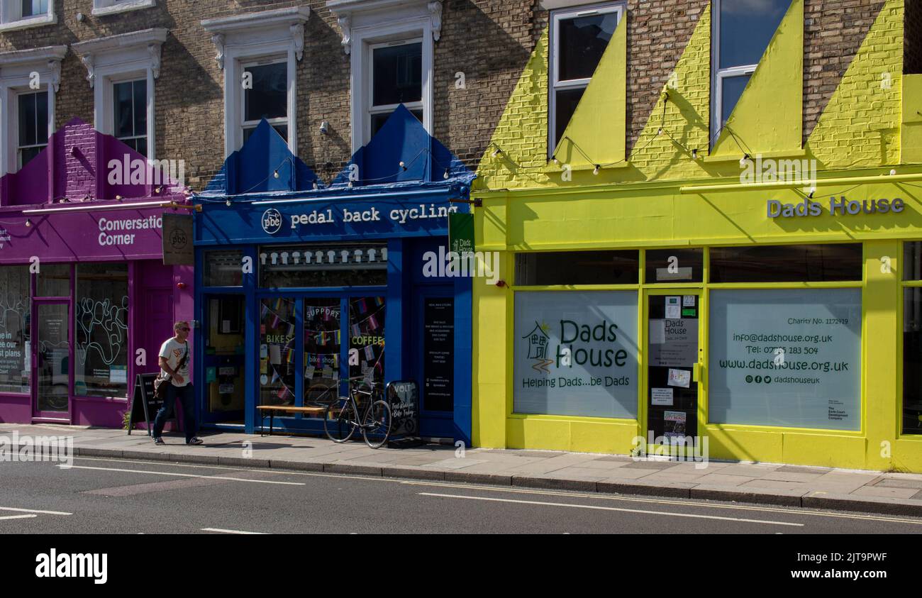 Shop fronts in Earls Court, West London; highly coloured frontages of an area developing after the demolition of the Earls Court arena Stock Photo