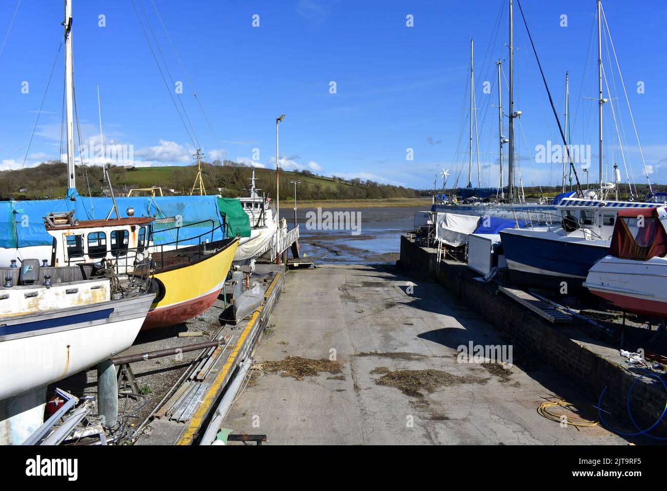 View down the slipway towards the Cleddau river at East Llanion boatyard, East Llanion, Pembrokeshire, Wales Stock Photo