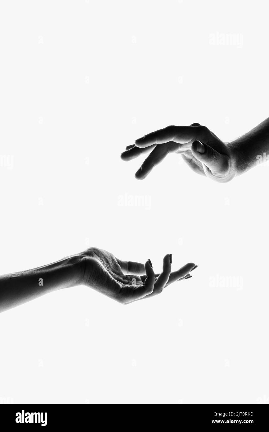 Tenderness. Monochrome. Authentic hands gesturing isolated on white background. Concept of feelings, community, care, support, symbolism, art Stock Photo