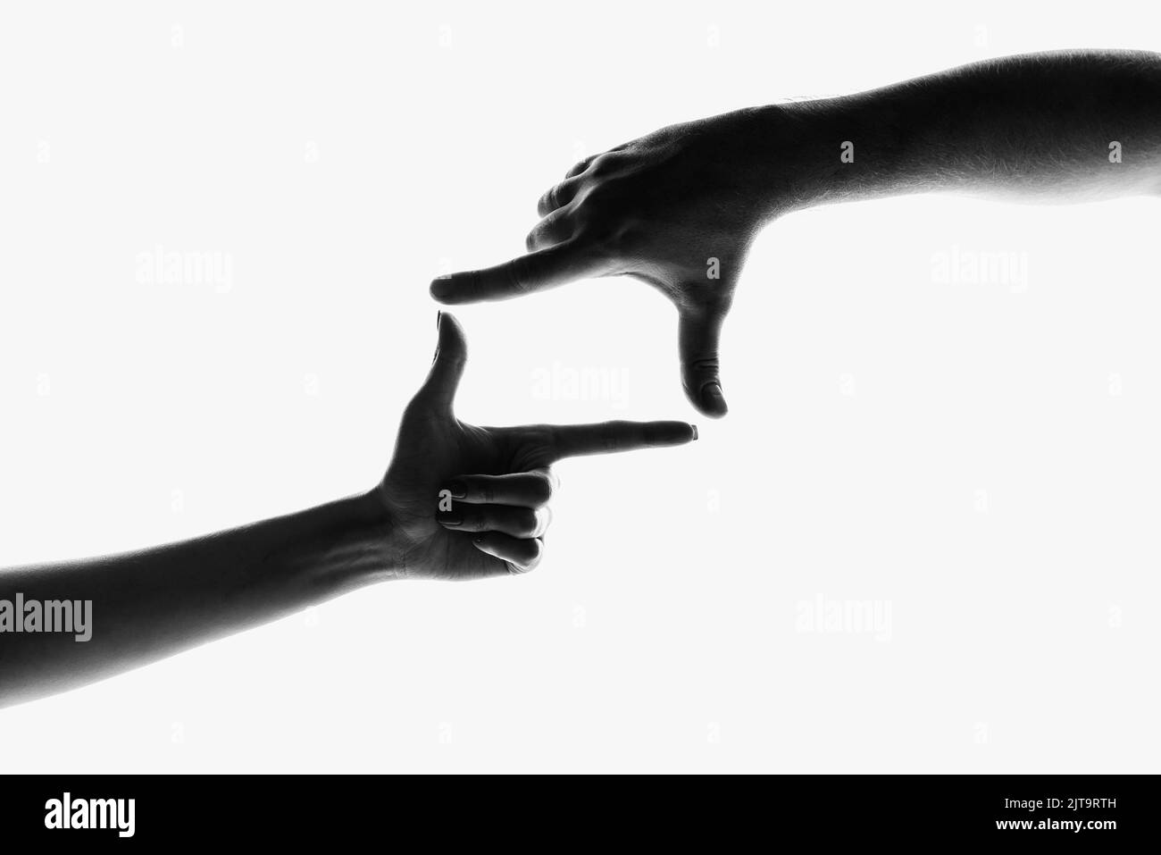 Fingers frame. Monochrome image of beautiful hands in different motion isolated on white background. Concept of emotions, creativity, symbolism, art Stock Photo