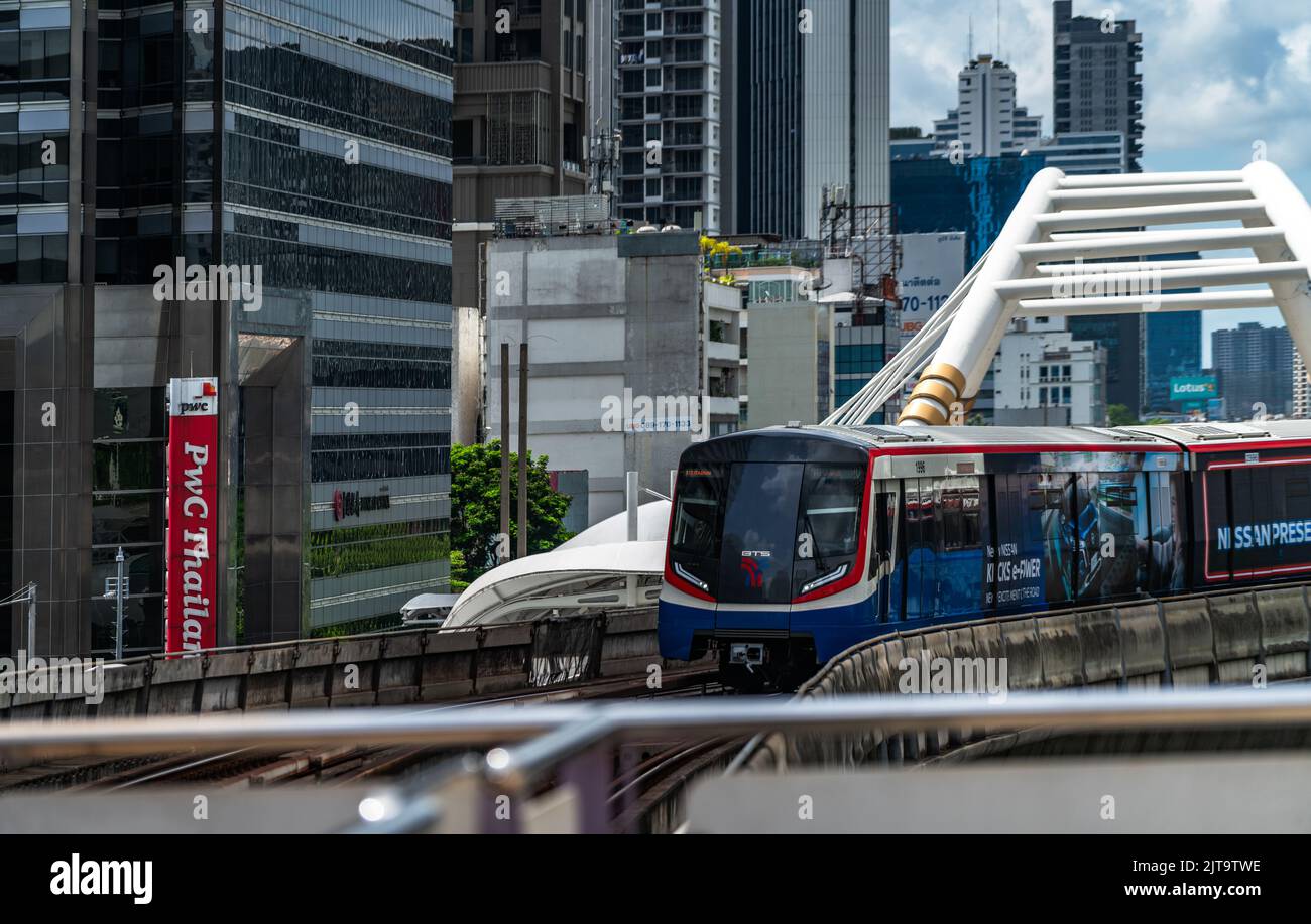 Bangkok, Thailand - Aug 13, 2022: Front of the Sky train or BTS train is arriving at the station downtown. Stock Photo