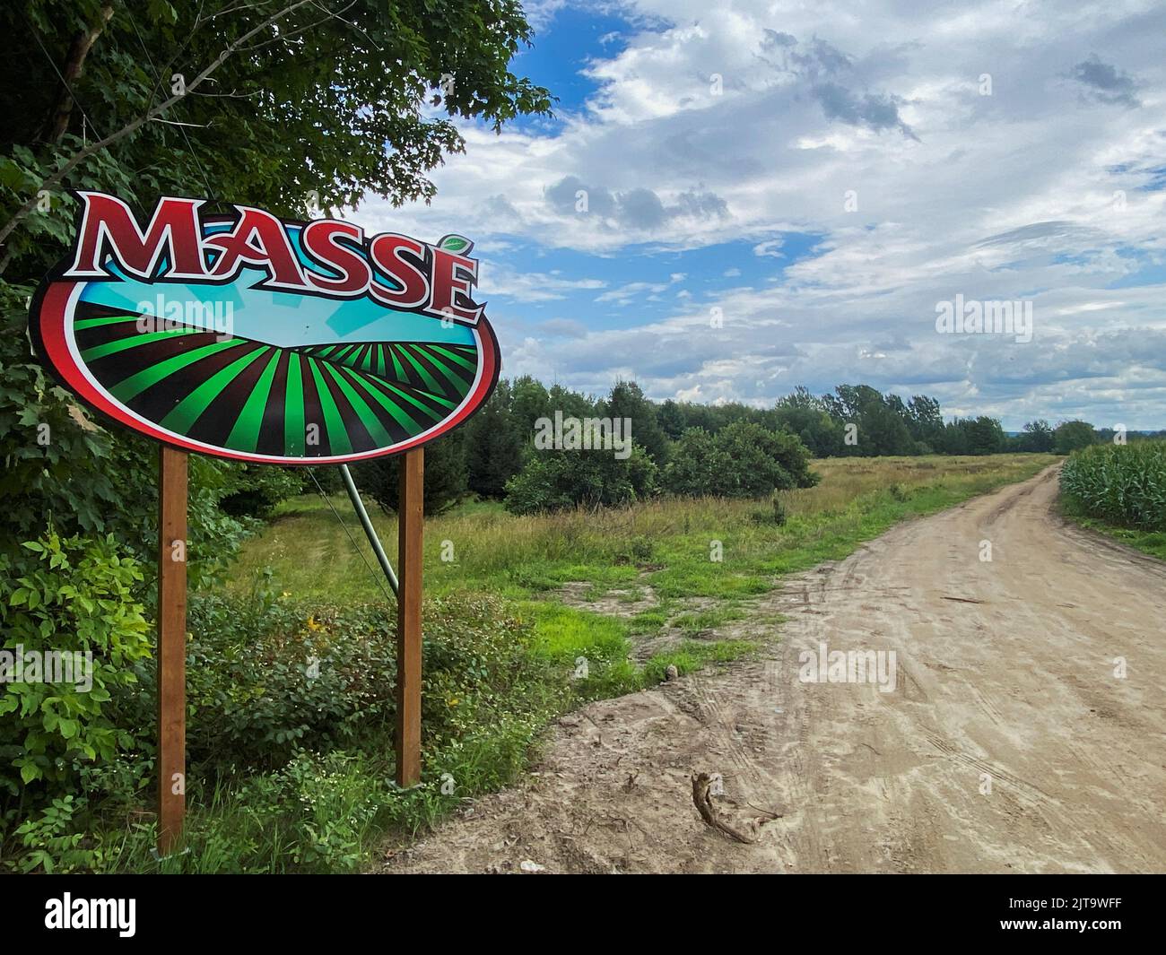 A sign shows the entrance to Pepiniere A. Masse, a berry farm operation in Saint Paul d'Abbotsford near Granby, Quebec, Canada August 11, 2022. REUTERS/Christinne Muschi Stock Photo