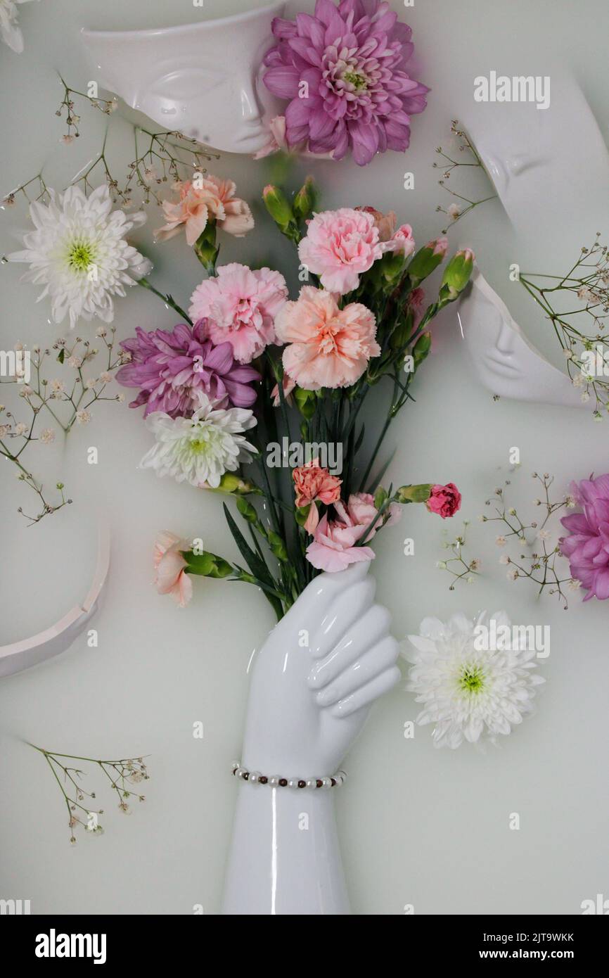 Hand Vase Holding Flowers Stock Photo Alamy