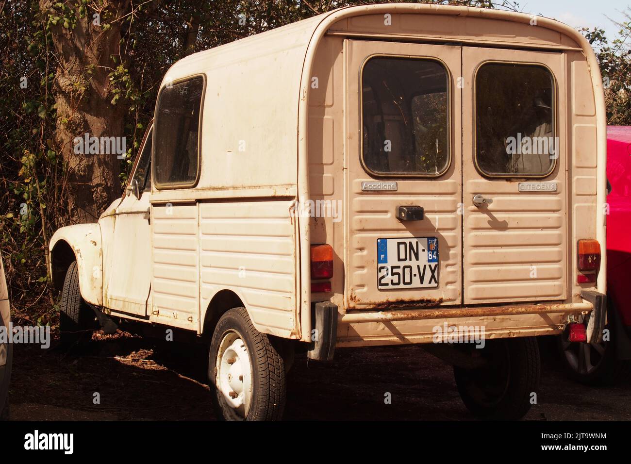An old, French, Citroen Dyane parked up in a car park lokking from a rear view Stock Photo