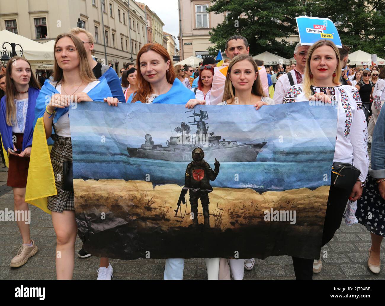 Cracow. Krakow. Poland. Ukrainian refugees celebrating Ukraine Independence Day at rally and parade. The  "Russian war ship fuck off" picture Stock Photo