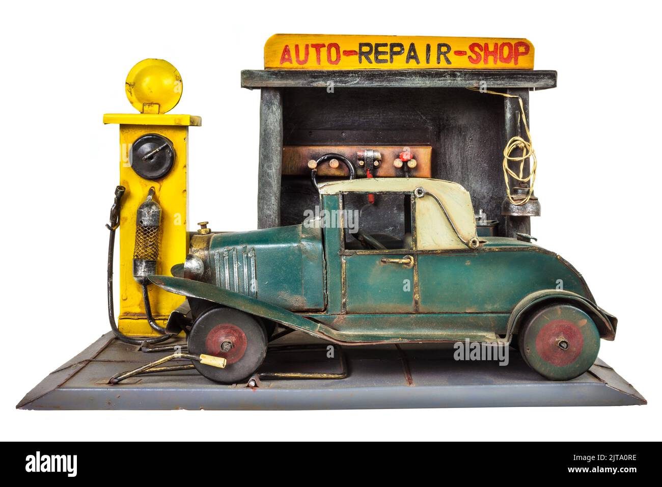 Retro toy car repair shop isolated on a white background Stock Photo