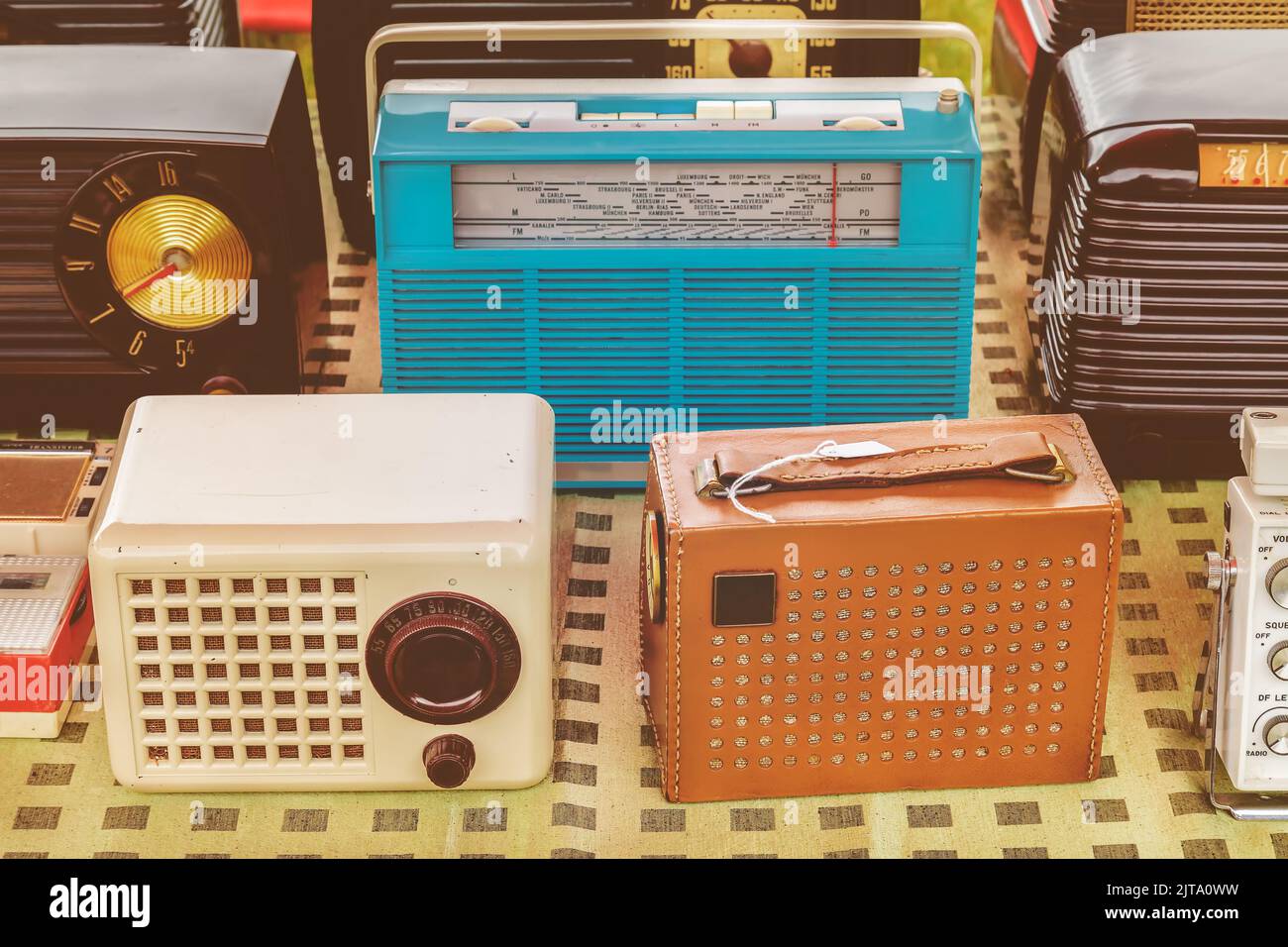 Retro styled image of old radio's for sale on a flee market Stock Photo