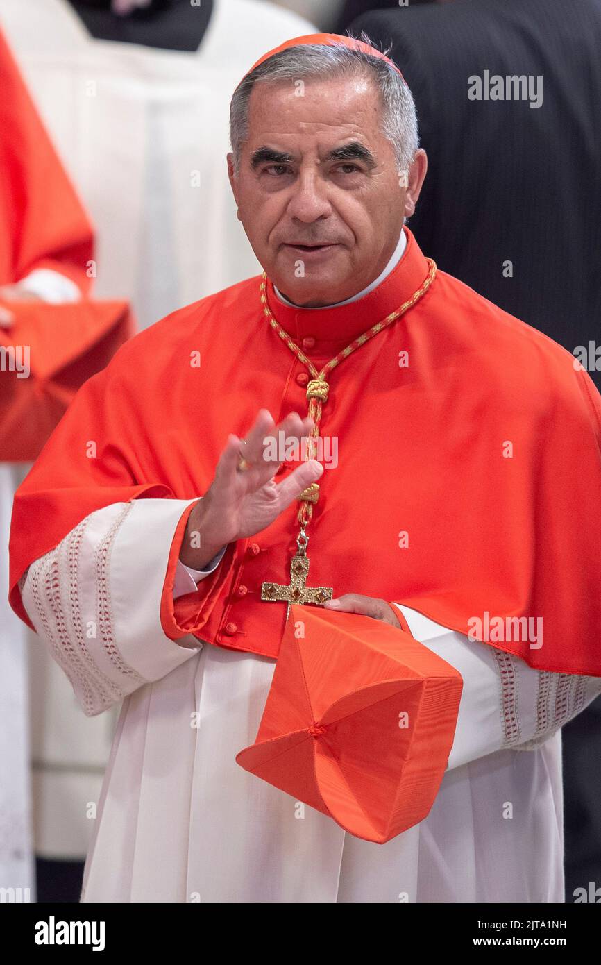 New Cardinal Giorgio Marengo receives the red three-cornered biretta hat  from Pope Francis during a consistory inside St. Peter's Basilica, at the  Vatican, Saturday, Aug. 27, 2022. Pope Francis has chosen 20