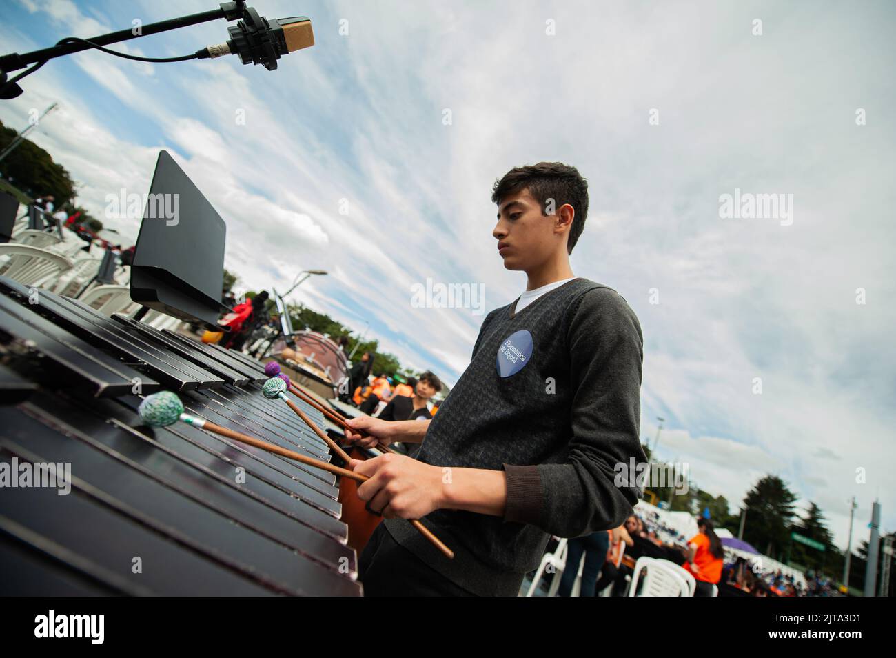 A musician plays the xylophone during the world's largest concert for peace played by Bogota's Symphonic Orchrestra and children, in Bogota, Colombia Stock Photo