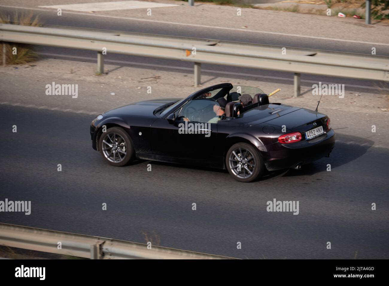 Mazda MX5 on highway. Malaga province, Andalusia, Spain. Stock Photo
