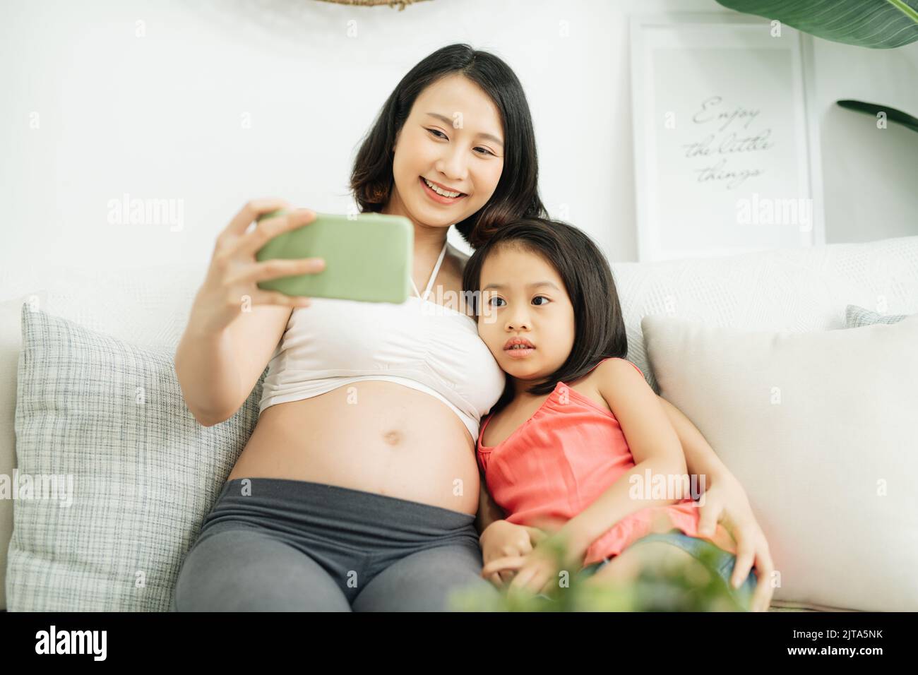 Mother and daughter taking pictures Stock Photo