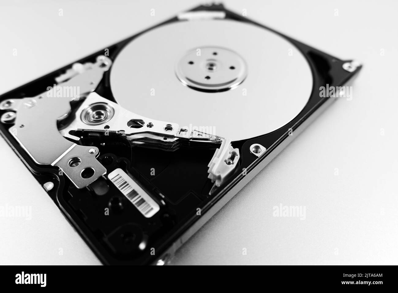 Computer hard drive with top cover removed. Disassembled HDD of a personal computer. Selective Focus Stock Photo