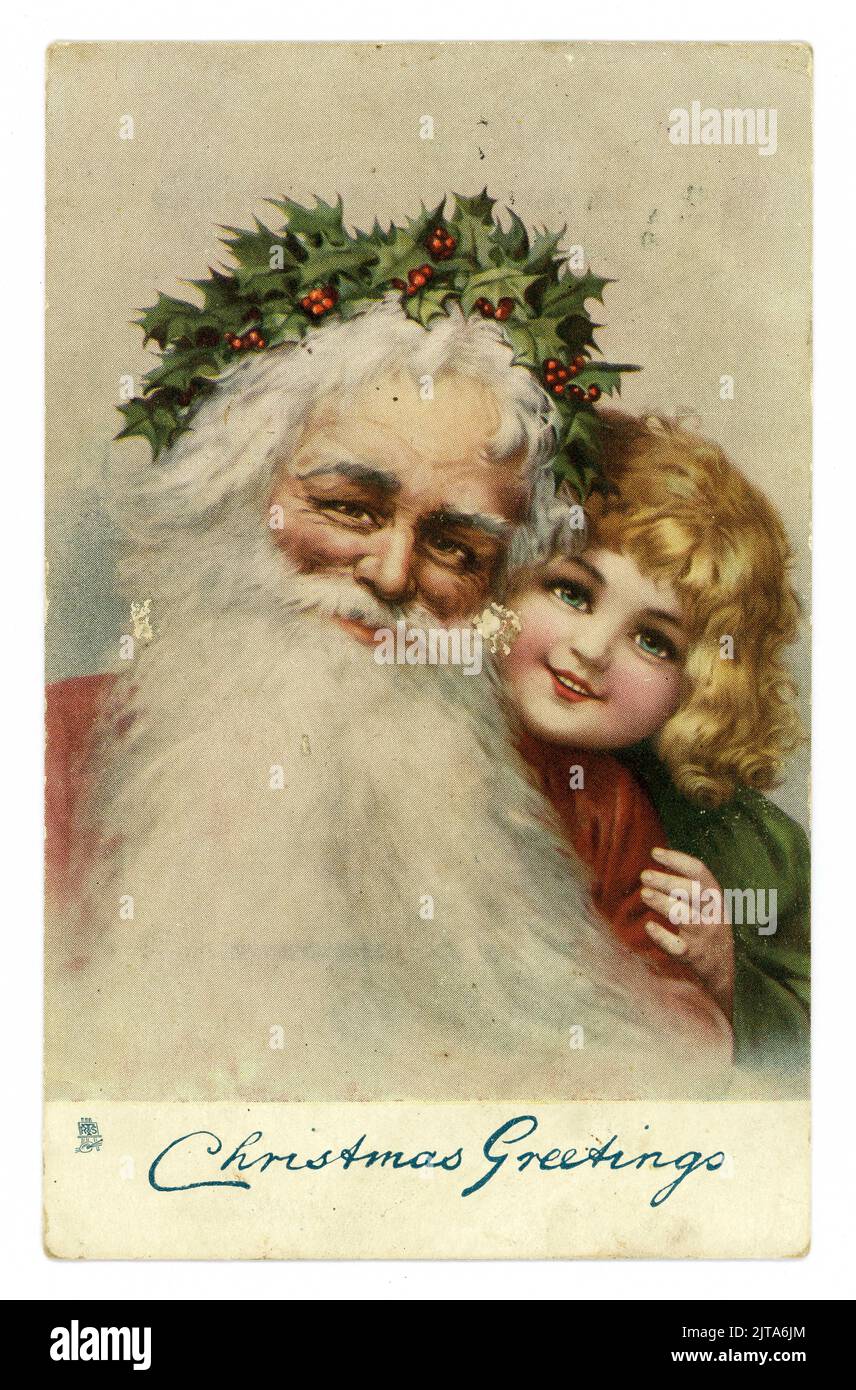 Original Edwardian Christmas greetings postcard, Santa with holly crown and small child, 'Christmas Greetings', Victorian Christmas card cards. dated and posted 20 Dec 1904, U.K. published. Stock Photo