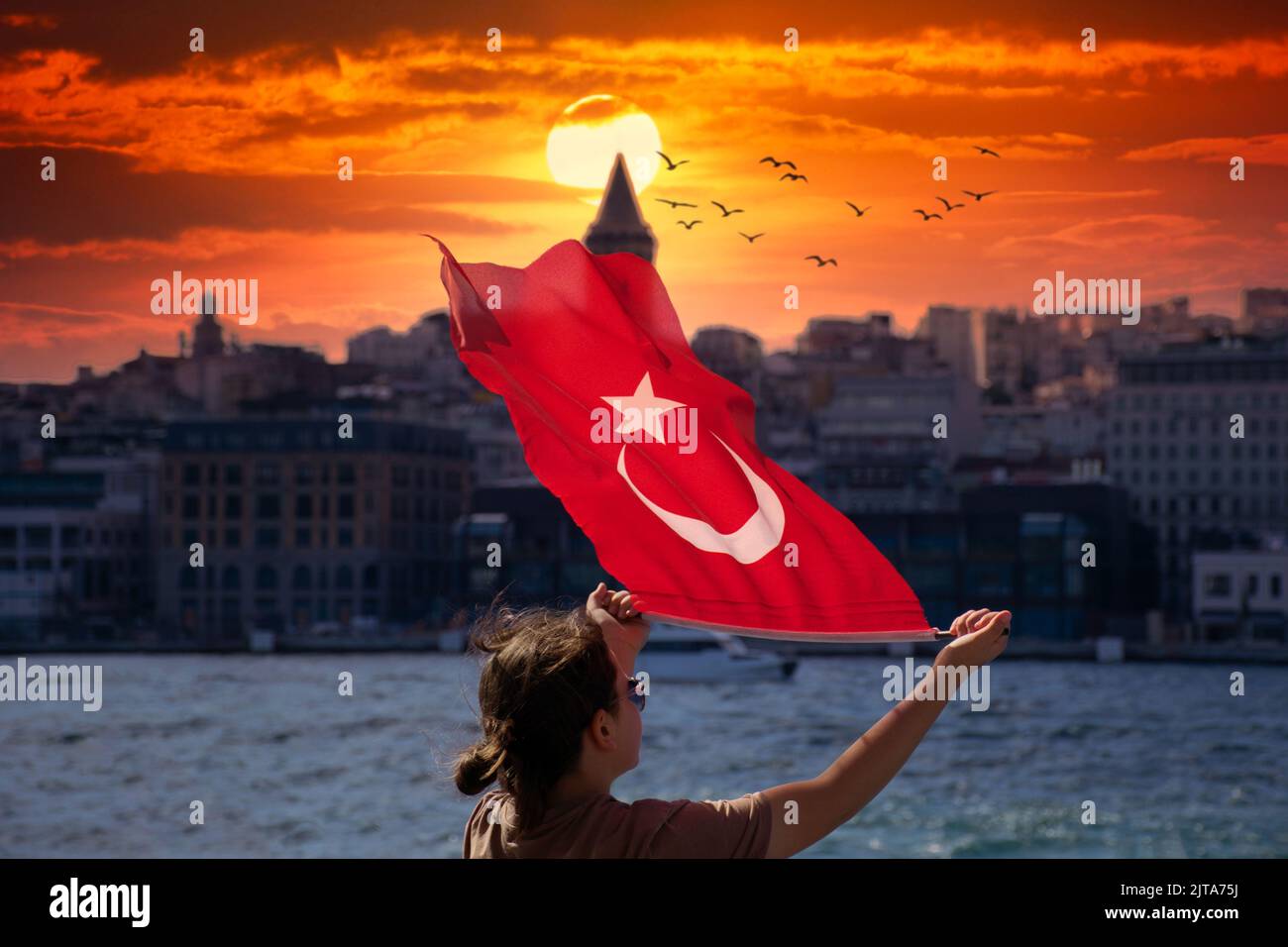 Little girls waving Turkish flag on a ship. Young girls waving Turkish