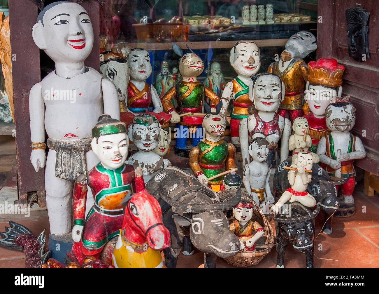 Vietnam, Hanoi Typical wooden statues for sale to tourists Stock Photo