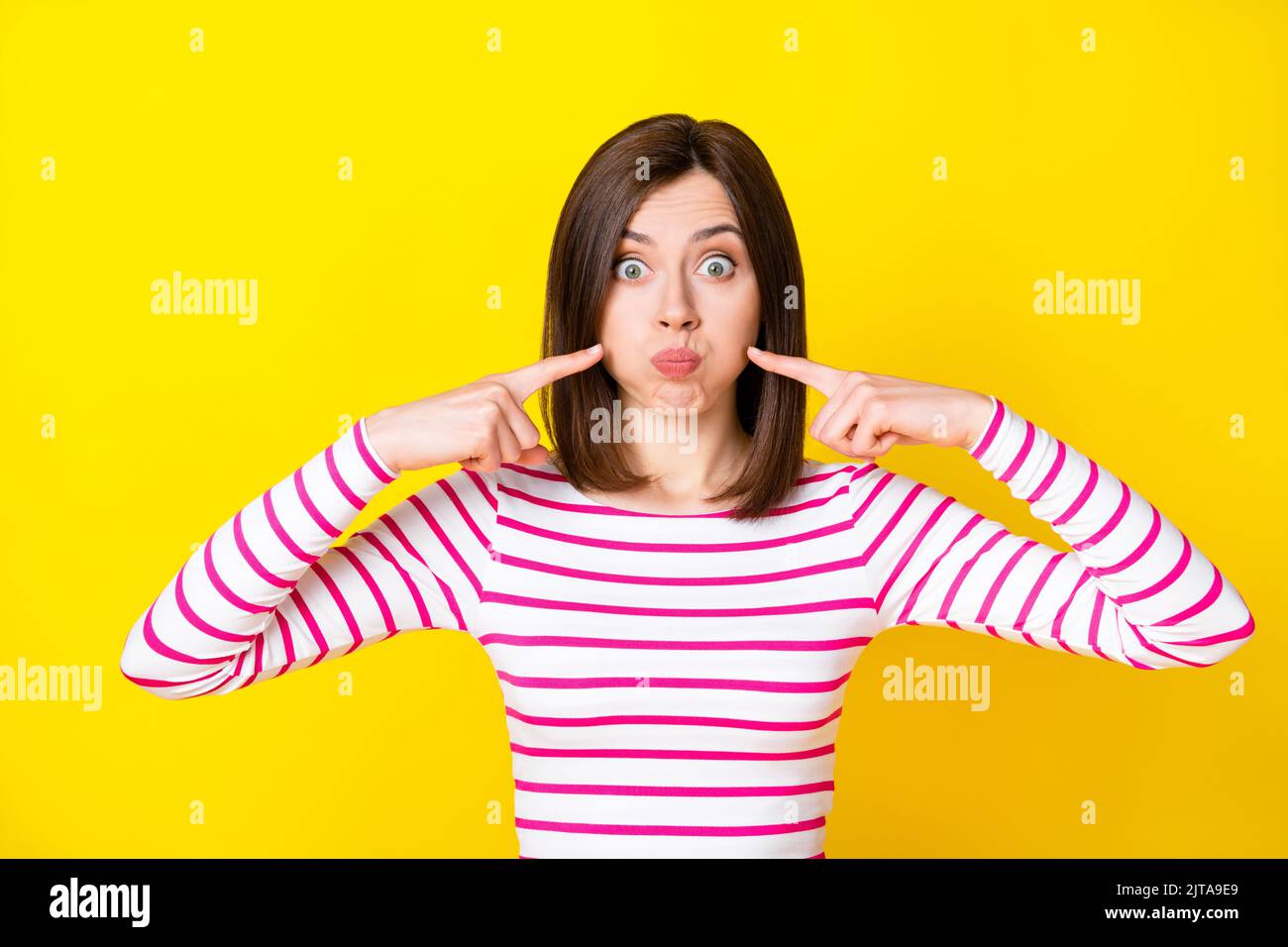 Photo Portrait Of Cute Young Woman Fingers Point Inflated Cheeks Hold Photo Portrait Of Cute Young Woman Fingers Point Inflated Cheeks Hold