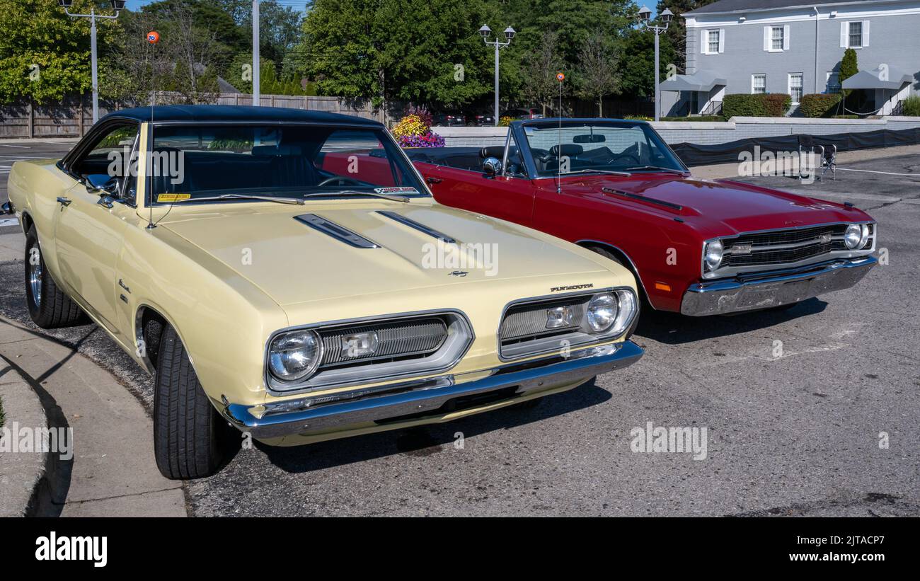 BIRMINGHAM, MI/USA - AUGUST 18, 2022: A 1968 Plymouth Barracuda and 1969 Dodge Dart GTS (GT Sport) car on the Woodward Dream Cruise route. Stock Photo