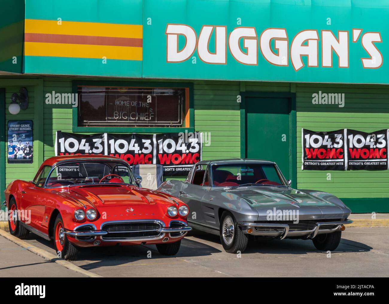 ROYAL OAK, MI/USA - AUGUST 18, 2022: A 1961 and 1963 Chevrolet Corvette cars at popular Duggan's Irish Pub on the Woodward Dream Cruise route. Stock Photo