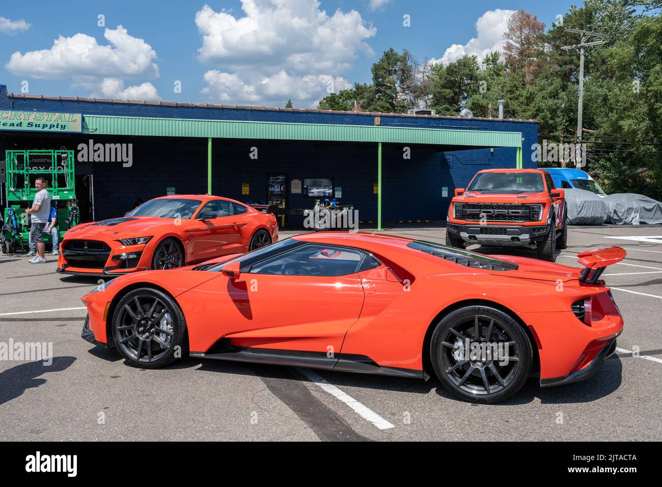 ROYAL OAK, MI/USA - AUGUST 19, 2022: A 2022 Ford Mustang Shelby Cobra, Ford GT and Ford F-150 Raptor at the Ford exhibit on the Woodward Dream Cruise Stock Photo