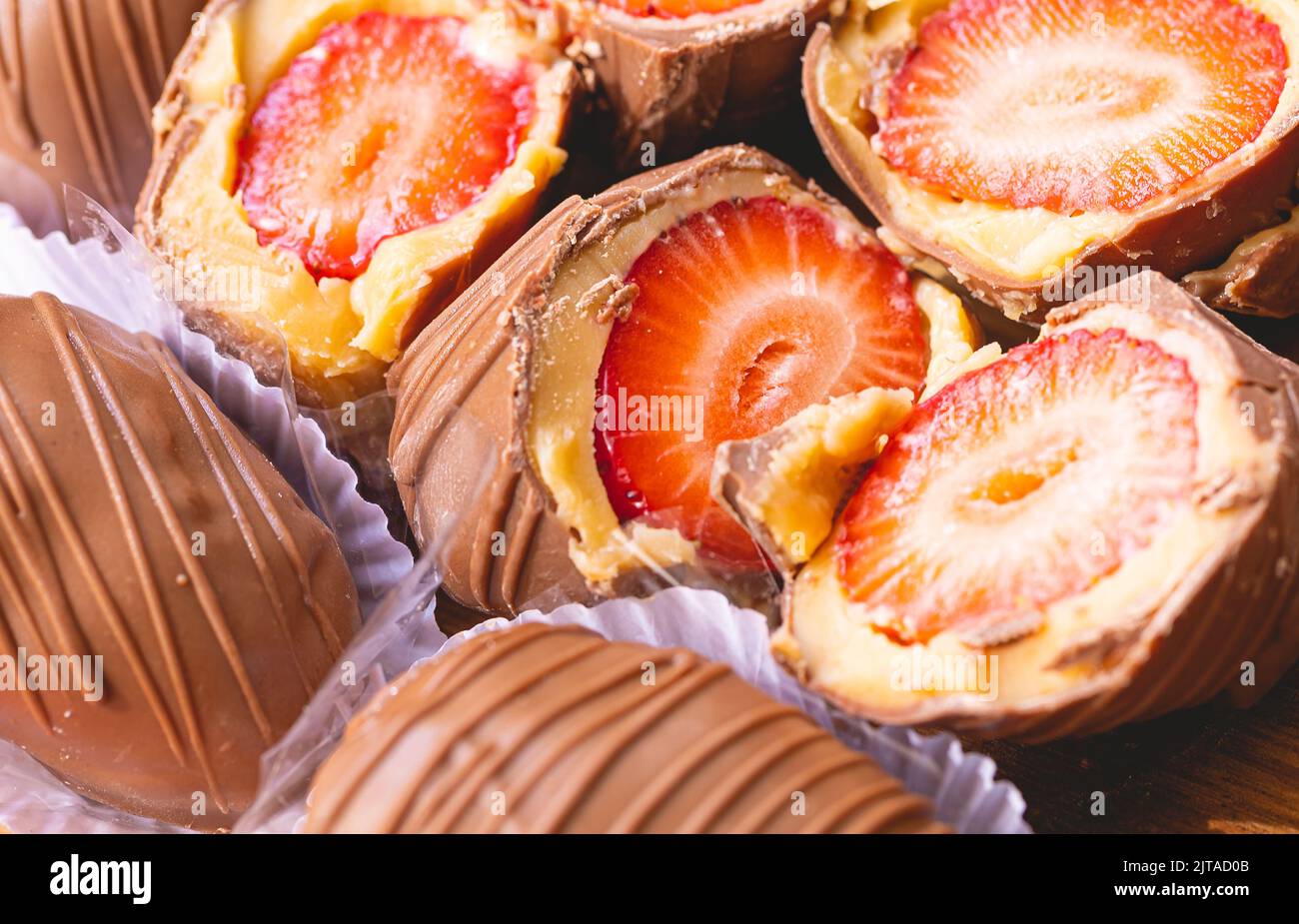 Strawberry bonbon in close-up photo. Brazilian sweet. Brazilian dessert with name in Brazilian Portuguese language of bombom de morango. Stock Photo
