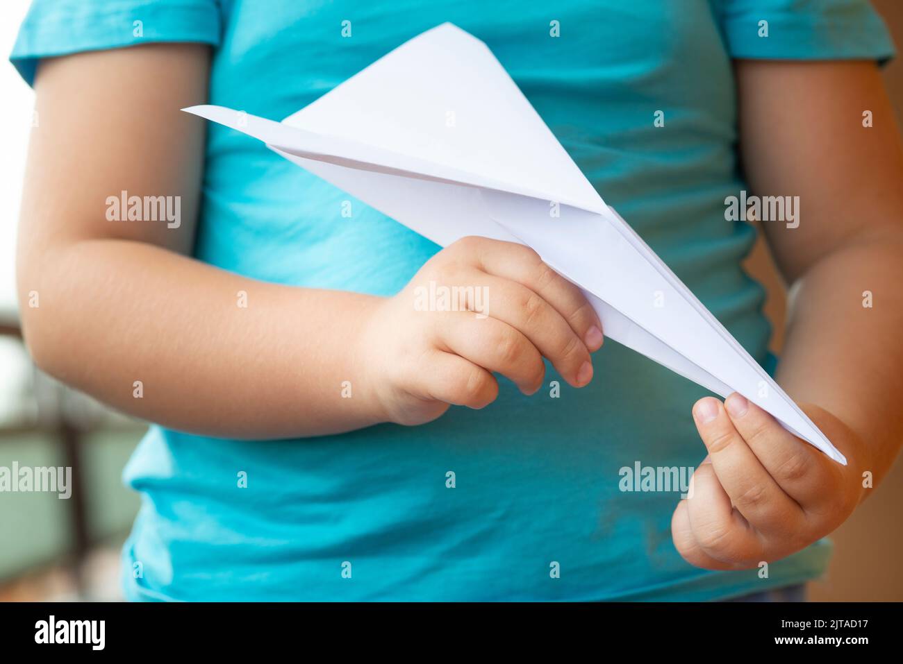 Child with Paper Plane Stock Photo