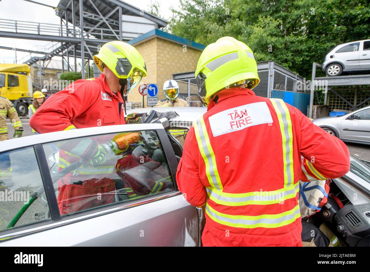 Firefighters use specialist equipment to practice extracting a stand in driver wearing sensors at Cardiff Gate Training Centre. Stock Photo