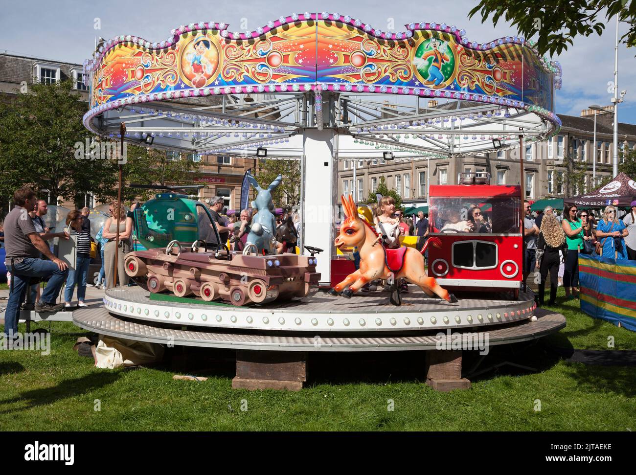 Childrens' roundabout at Fayre, Helensburgh, Scotland Stock Photo
