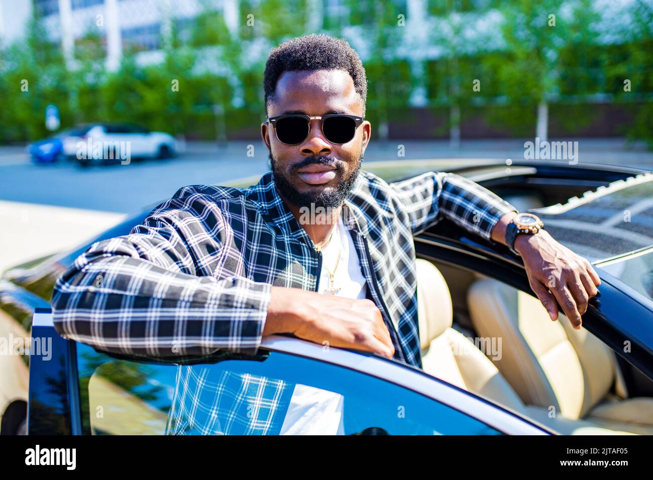 latin hispanic man in a stylish plaid suit wear glasses in luxury