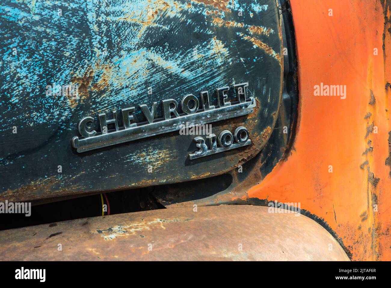 Close up of a Chevrolet badge on an old rusty 3100 pick-up truck Stock Photo