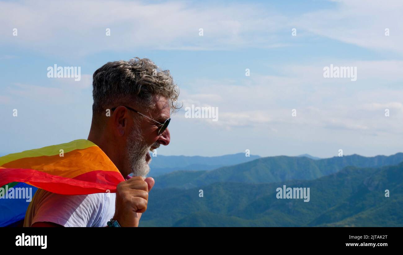 Gray-haired senior elderly Caucasian man bisexuality with a beard and