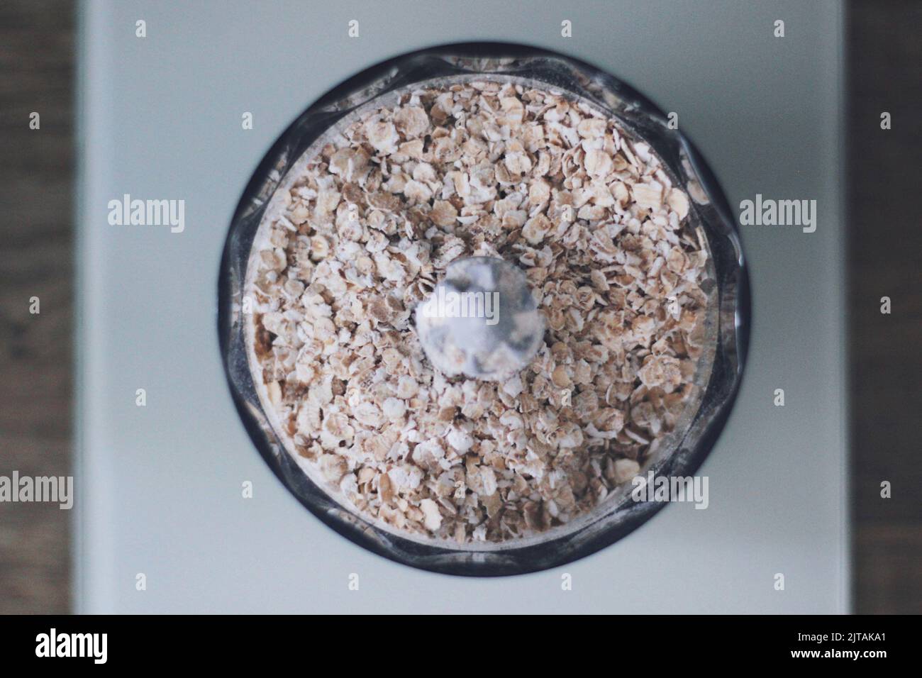 Pure oat flakes in a food processor Stock Photo Alamy
