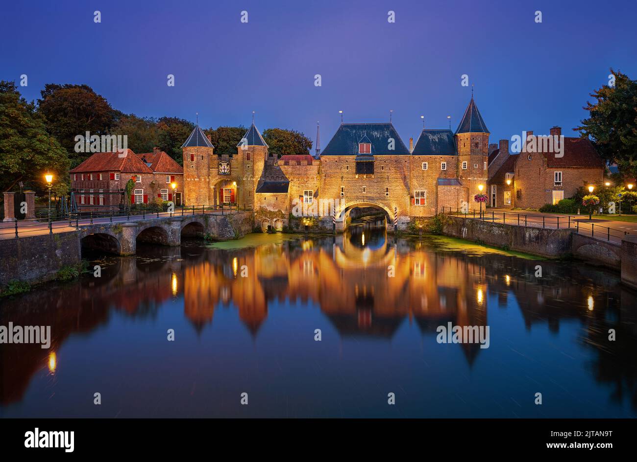 The Koppelpoort is a Medieval city gate in the town of Amersfoort in the Netherlands. It is a well known landmark which is illuminated at night. Stock Photo