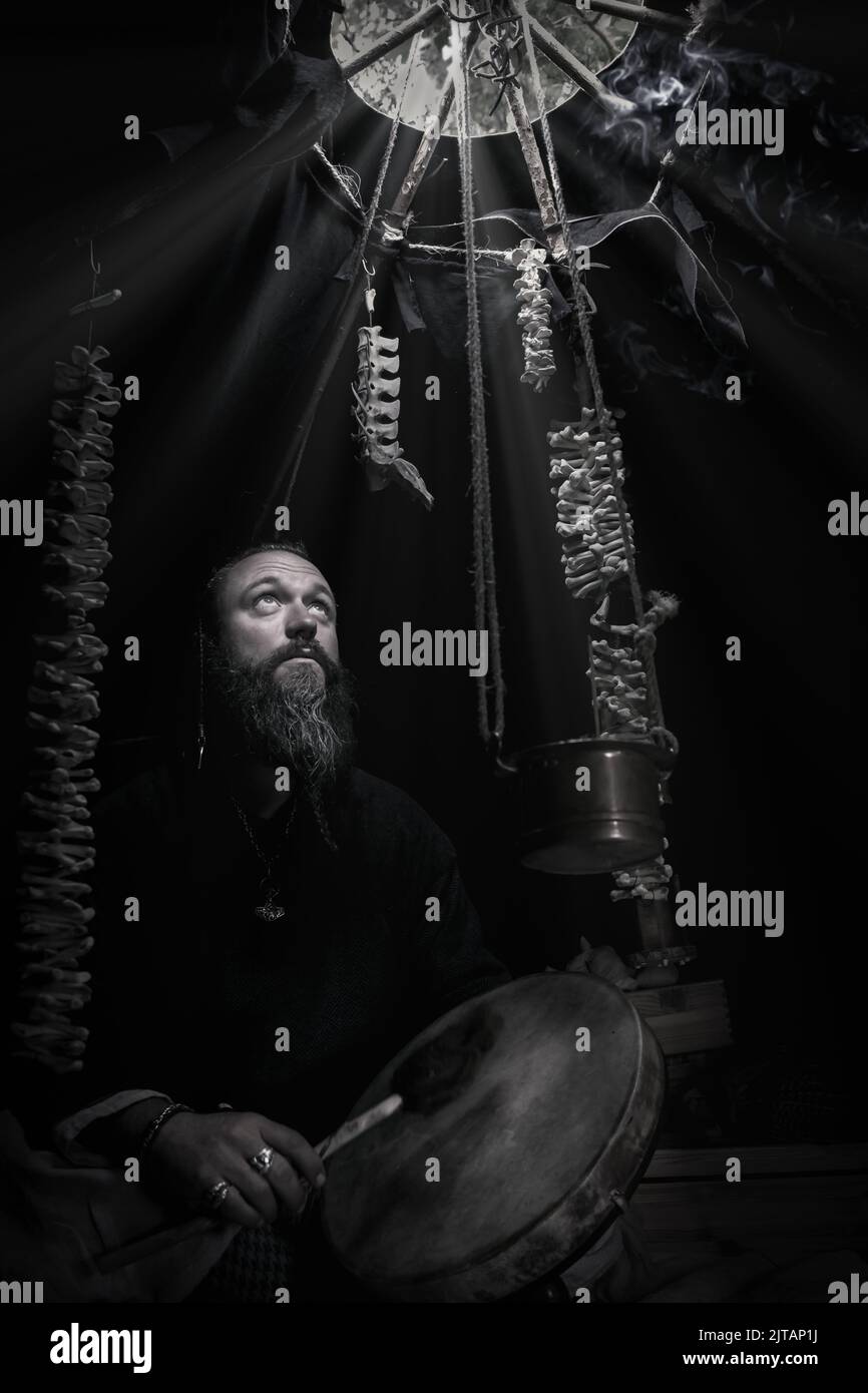 Portrait of man dressed as a Viking playing a drum, Trelleborg, Denmark Stock Photo